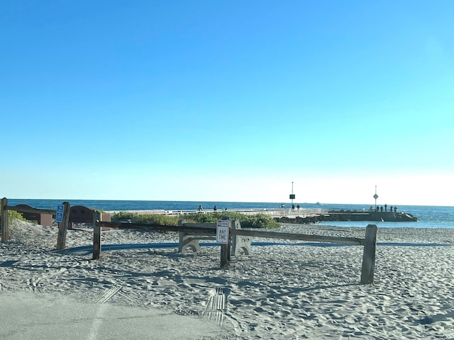 surrounding community featuring a water view