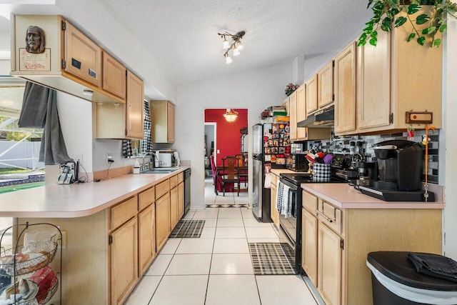 kitchen with lofted ceiling, light tile patterned floors, light brown cabinets, and black appliances