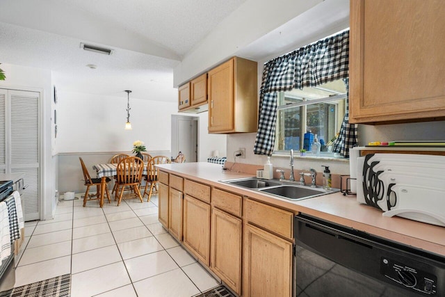 kitchen featuring light tile patterned floors, sink, hanging light fixtures, black dishwasher, and a textured ceiling