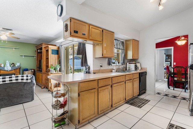 kitchen with vaulted ceiling, black dishwasher, light tile patterned floors, kitchen peninsula, and a textured ceiling