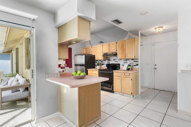 kitchen featuring light brown cabinets, stainless steel refrigerator, kitchen peninsula, black range with electric stovetop, and decorative backsplash