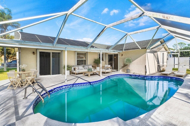 view of swimming pool featuring a patio, an outdoor hangout area, and glass enclosure