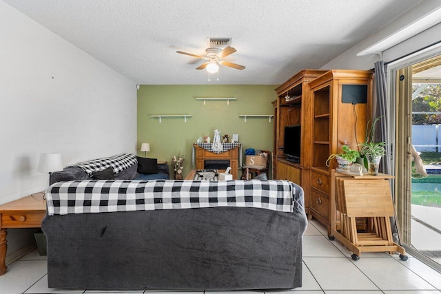 tiled bedroom featuring access to outside and a textured ceiling