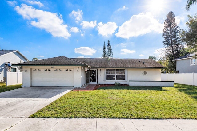 single story home featuring a garage and a front lawn