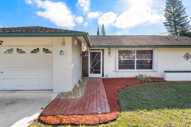 single story home featuring a garage and a front yard