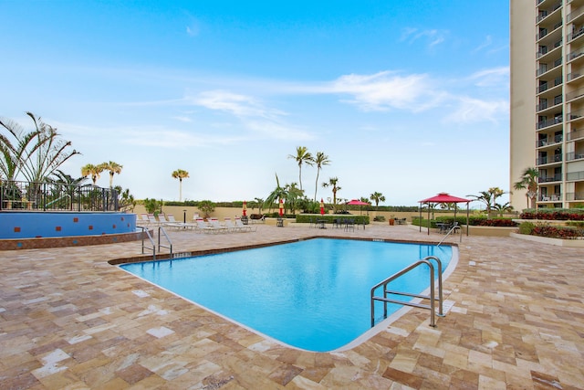 view of pool featuring a gazebo and a patio area