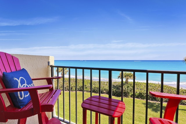 balcony with a view of the beach and a water view