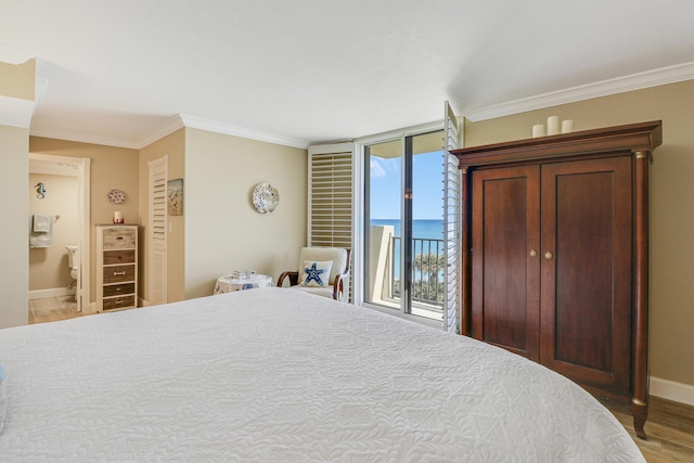 bedroom featuring crown molding, access to outside, a water view, and hardwood / wood-style flooring