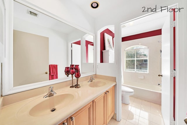 full bathroom featuring tile patterned floors, vanity, toilet, and  shower combination