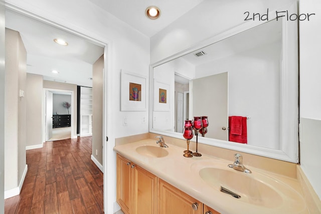 bathroom featuring hardwood / wood-style flooring and vanity