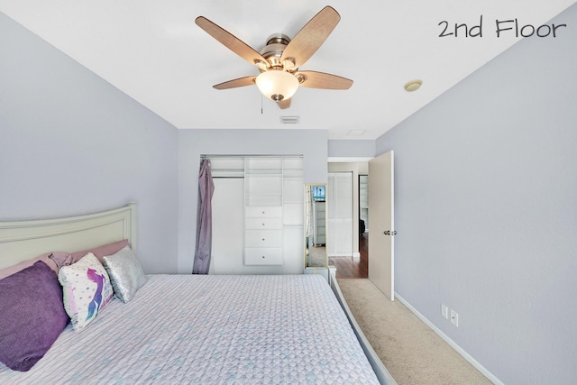 bedroom featuring a closet, ceiling fan, and carpet