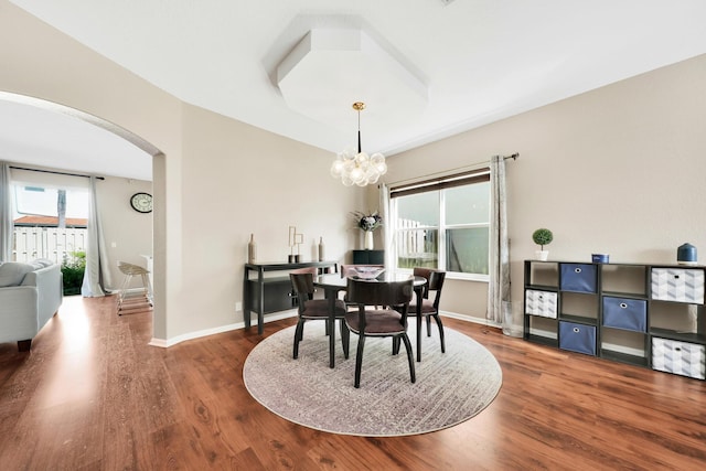 dining room featuring an inviting chandelier and hardwood / wood-style floors