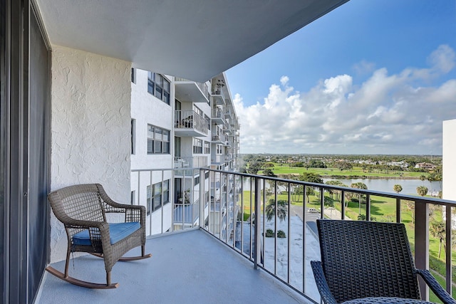 balcony featuring a water view