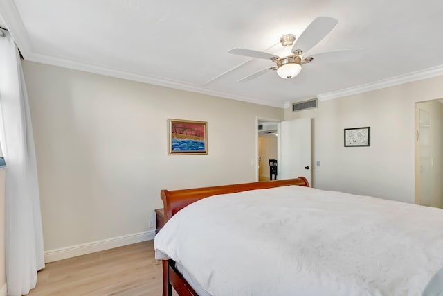 bedroom with crown molding, ceiling fan, and light hardwood / wood-style flooring