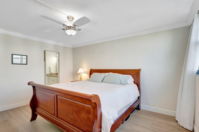 bedroom featuring ensuite bath, ornamental molding, ceiling fan, and light wood-type flooring