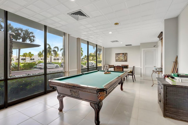 rec room with light tile patterned flooring, pool table, and floor to ceiling windows