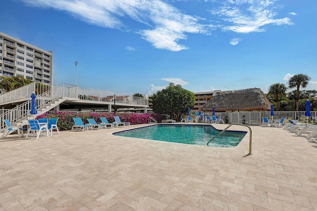 view of pool featuring a patio area