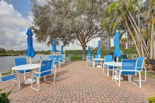 view of patio featuring a water view