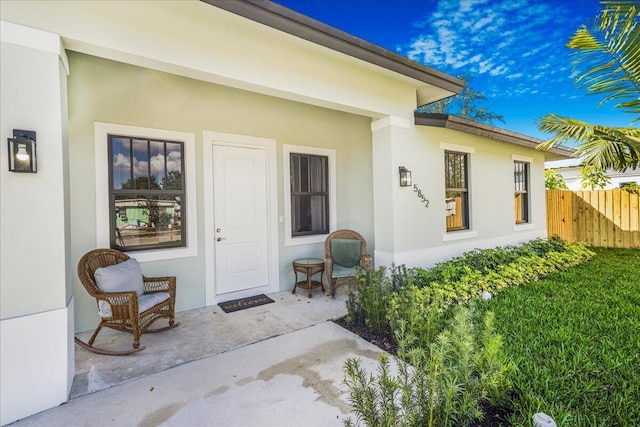 entrance to property featuring a patio