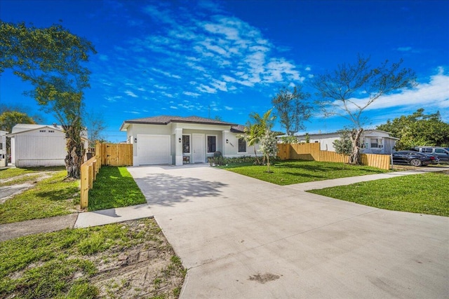 ranch-style house with a garage and a front lawn