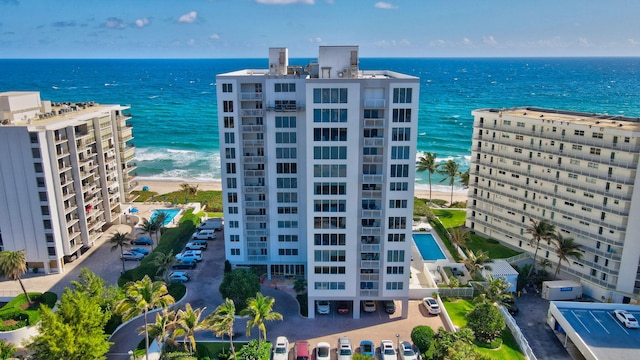 birds eye view of property featuring a view of the beach and a water view