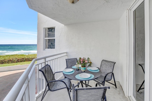 balcony featuring a water view