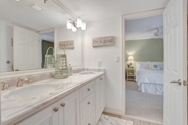 bathroom featuring vanity and ceiling fan