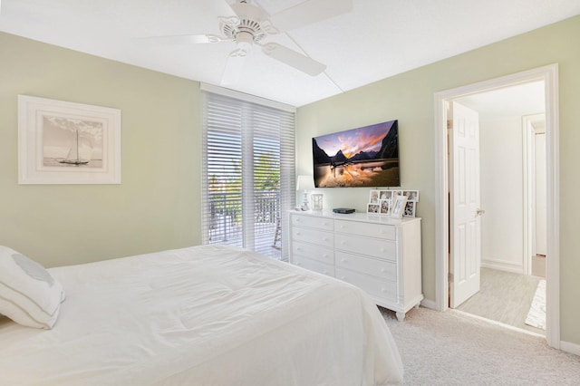 bedroom with access to outside, light colored carpet, and ceiling fan