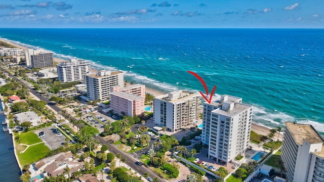 bird's eye view with a water view and a view of the beach