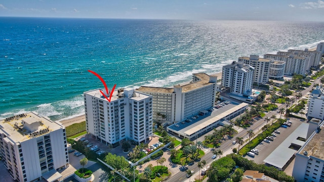 aerial view featuring a water view and a view of the beach