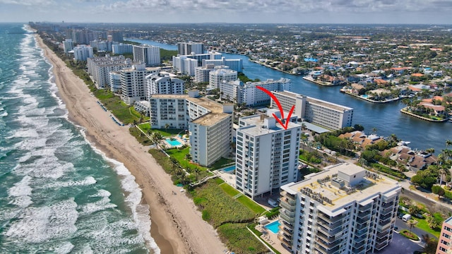 bird's eye view featuring a water view and a view of the beach