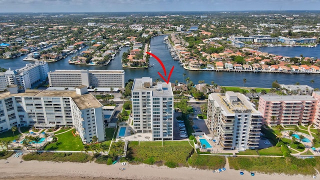 birds eye view of property with a water view