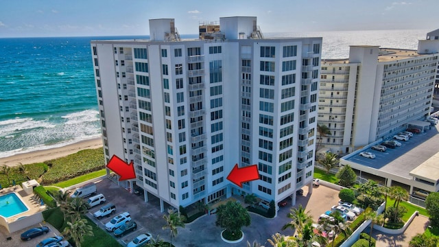 bird's eye view with a beach view and a water view