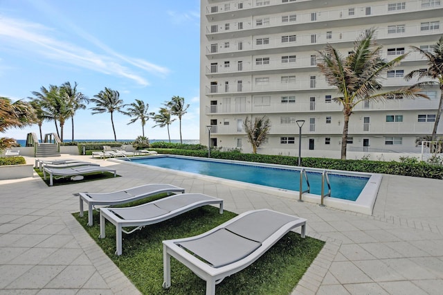 view of swimming pool featuring a patio area