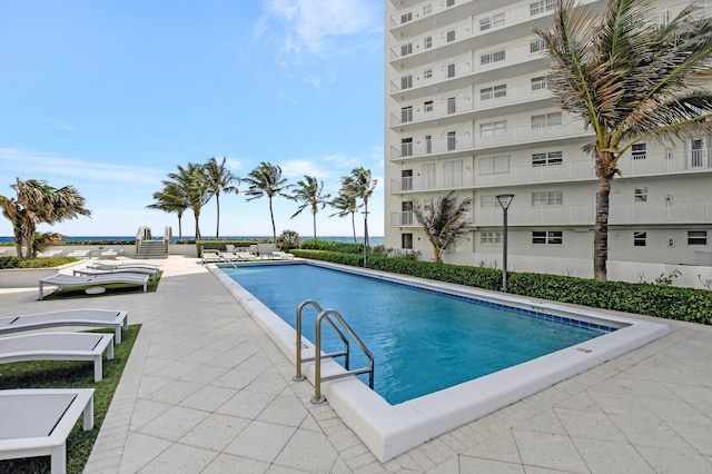 view of pool featuring a patio