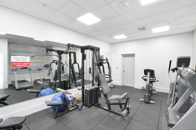 exercise room featuring a paneled ceiling