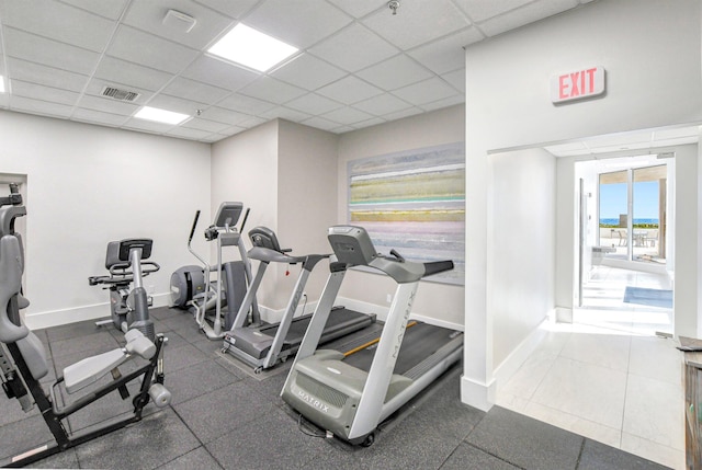 workout area with a drop ceiling