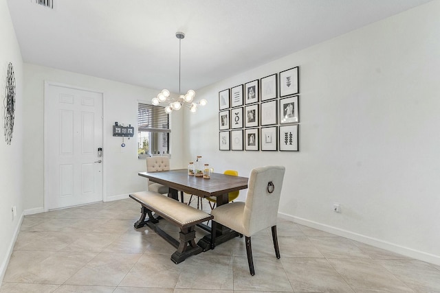 dining space with an inviting chandelier and light tile patterned floors