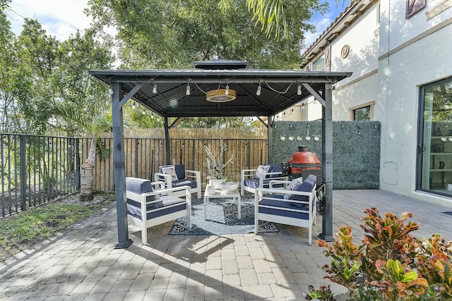 view of patio / terrace featuring a gazebo and an outdoor hangout area