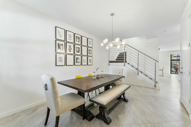 tiled dining area with an inviting chandelier