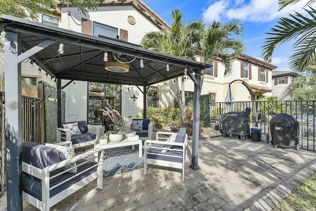 view of patio featuring a gazebo, grilling area, and outdoor lounge area