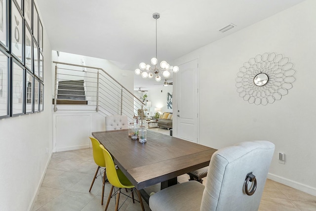 dining space featuring a notable chandelier and light tile patterned flooring