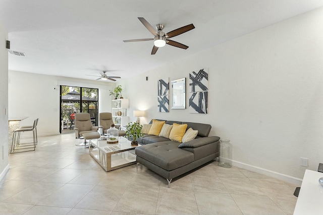 living room featuring light tile patterned flooring and ceiling fan