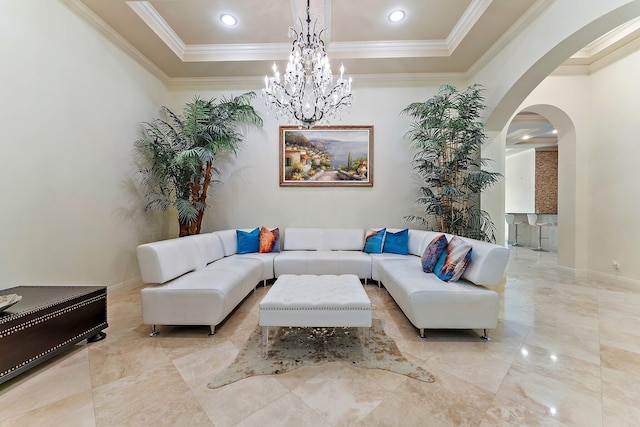 living room featuring ornamental molding and a raised ceiling