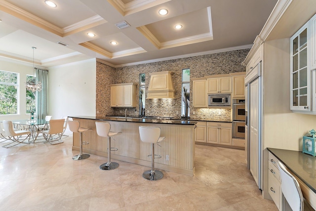 kitchen featuring tasteful backsplash, premium range hood, appliances with stainless steel finishes, and a breakfast bar