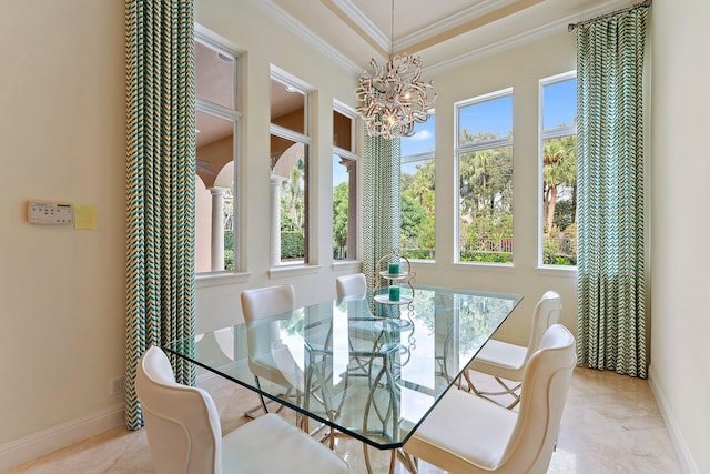 dining area featuring ornamental molding and a chandelier