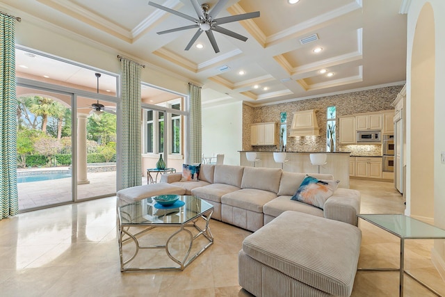 tiled living room featuring beam ceiling, coffered ceiling, and ceiling fan