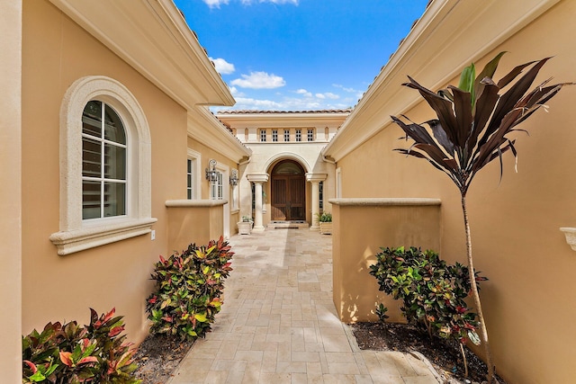 entrance to property with a patio area