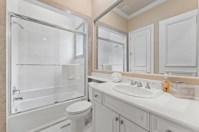 full bathroom featuring vanity, crown molding, shower / bath combination with glass door, and toilet