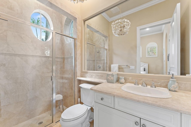 bathroom with crown molding, vanity, toilet, and an enclosed shower